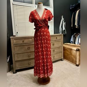 Red and orange patterned wrap dress; size small, never been worn, tags attached